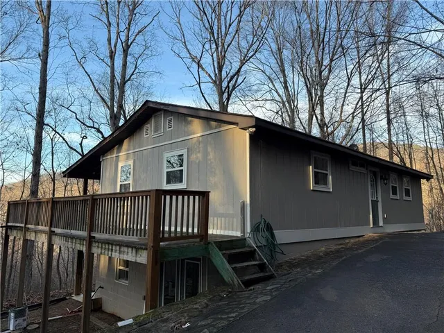a kitchen with a sink stove top oven and microwave