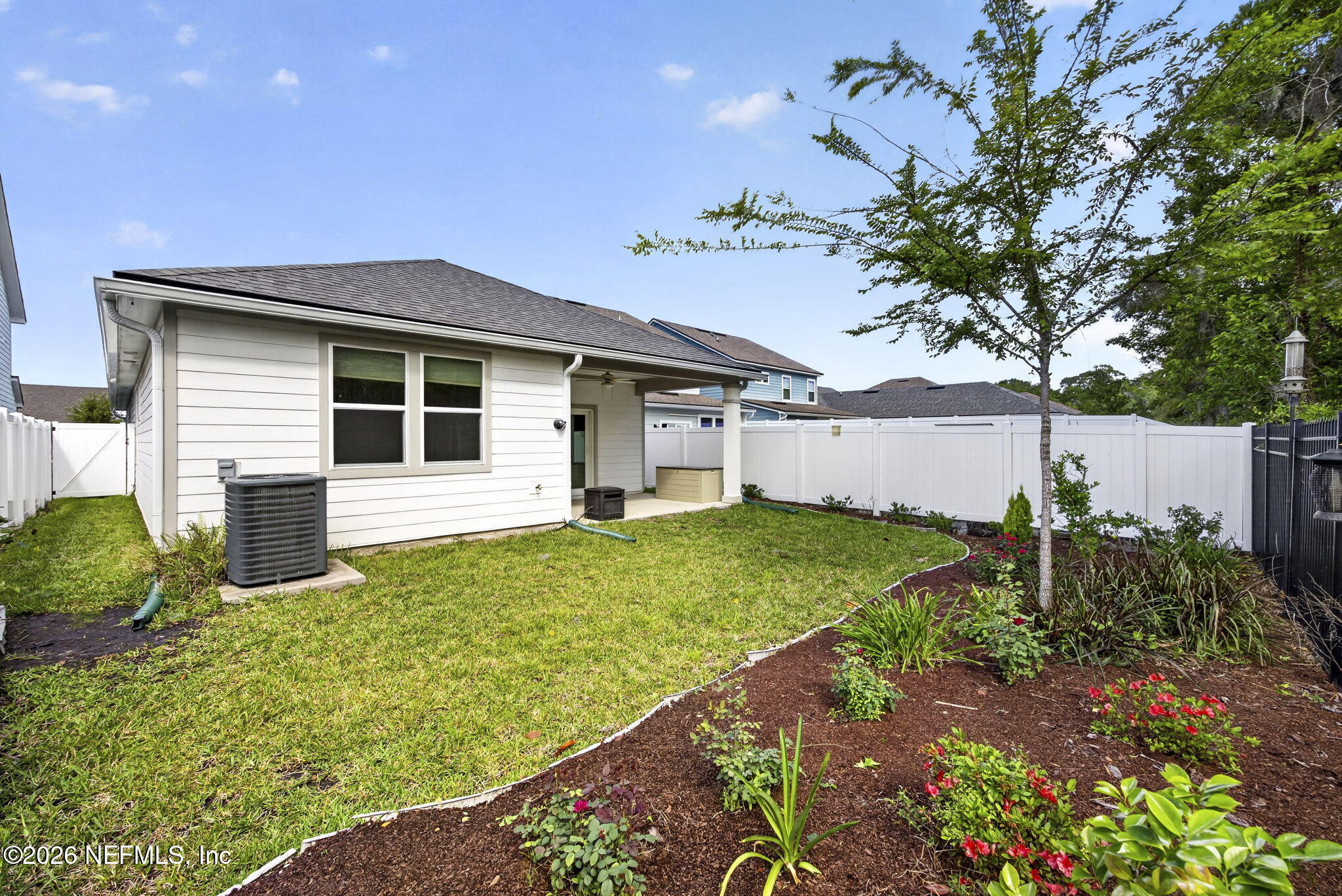 3105 Orange Picker Road Jacksonville, FL 32223 - Photo 26 of 26 Backyard with flower bed