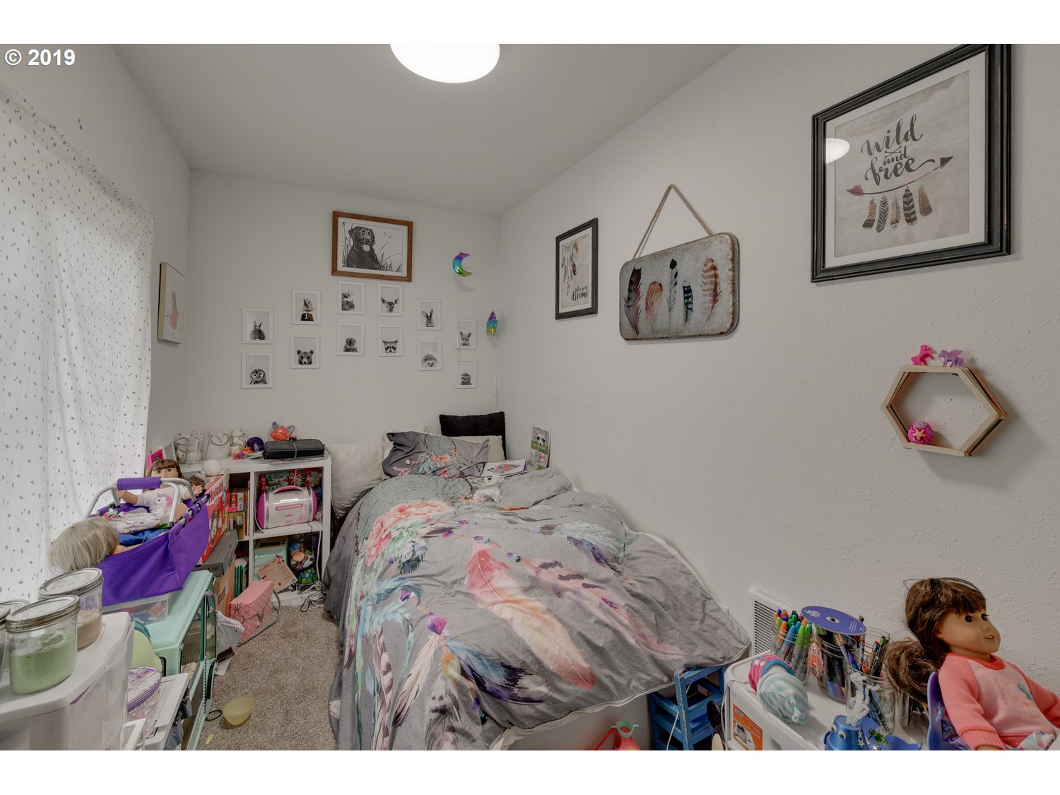 20188 South Redland Road Oregon City, OR 97045 - Photo 13 of 31 a bedroom with a bed and a chandelier