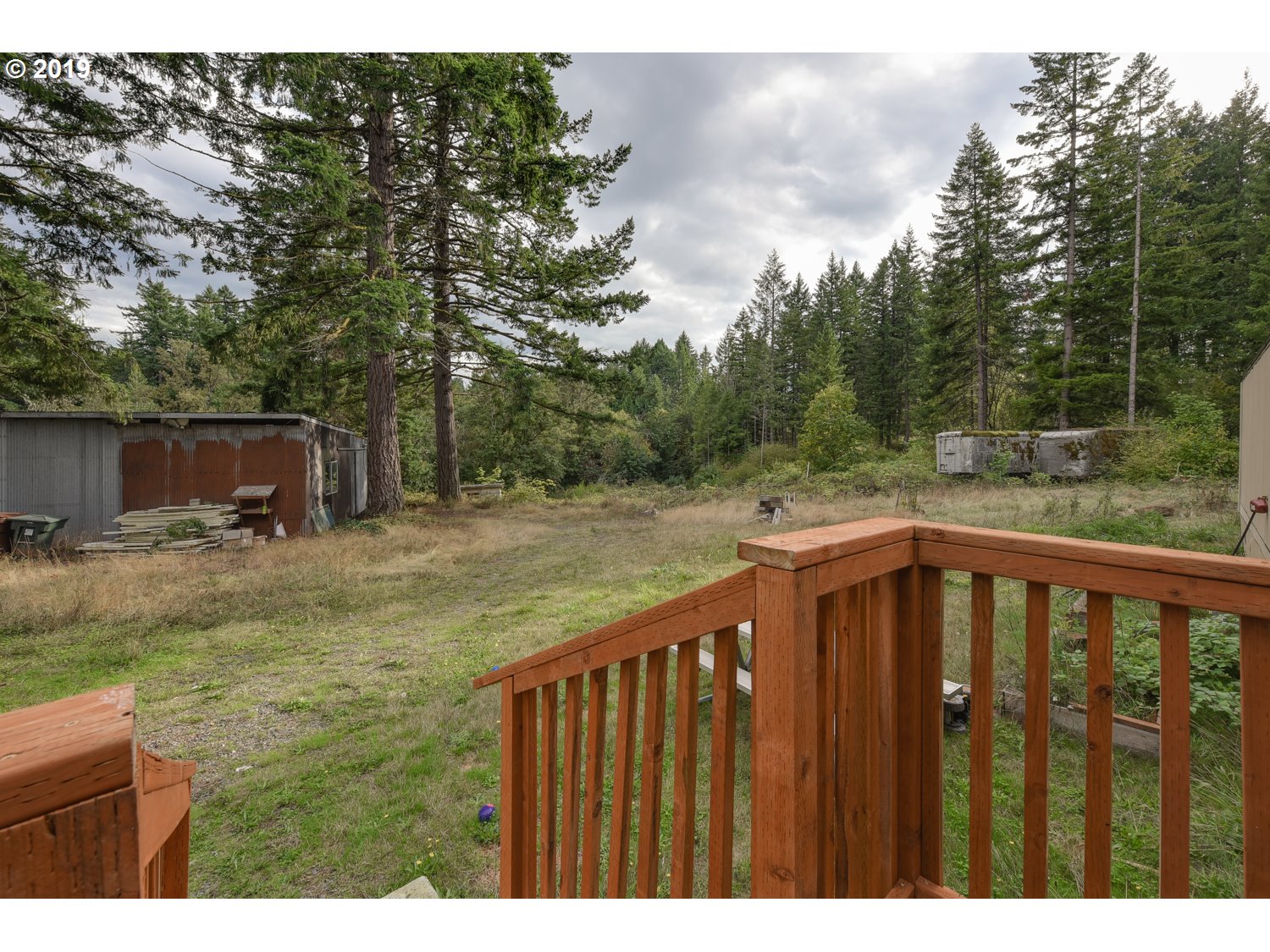 20188 South Redland Road Oregon City, OR 97045 - Photo 19 of 31 a balcony with wooden floor and yard in the back