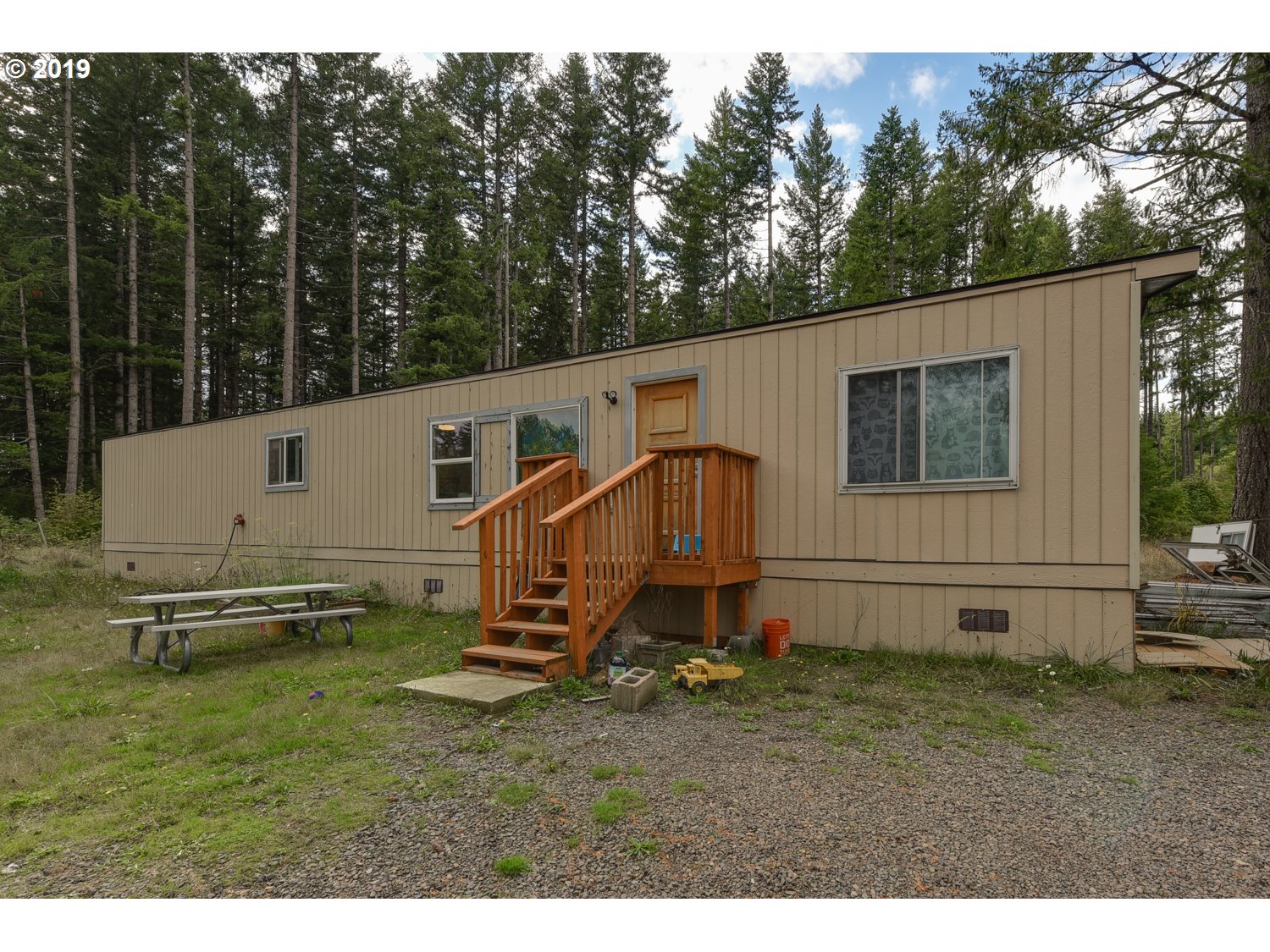 20188 South Redland Road Oregon City, OR 97045 - Photo 2 of 31 a view of a white house with a big yard and sitting area