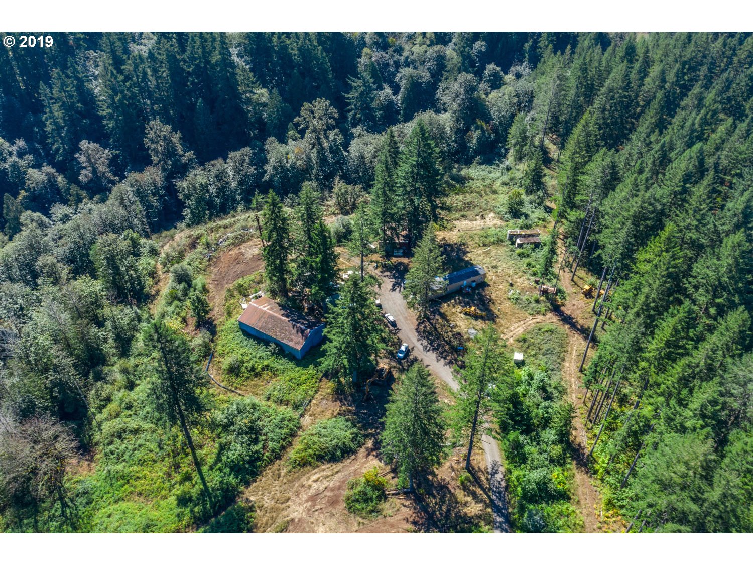 20188 South Redland Road Oregon City, OR 97045 - Photo 26 of 31 a view of a house in a forest