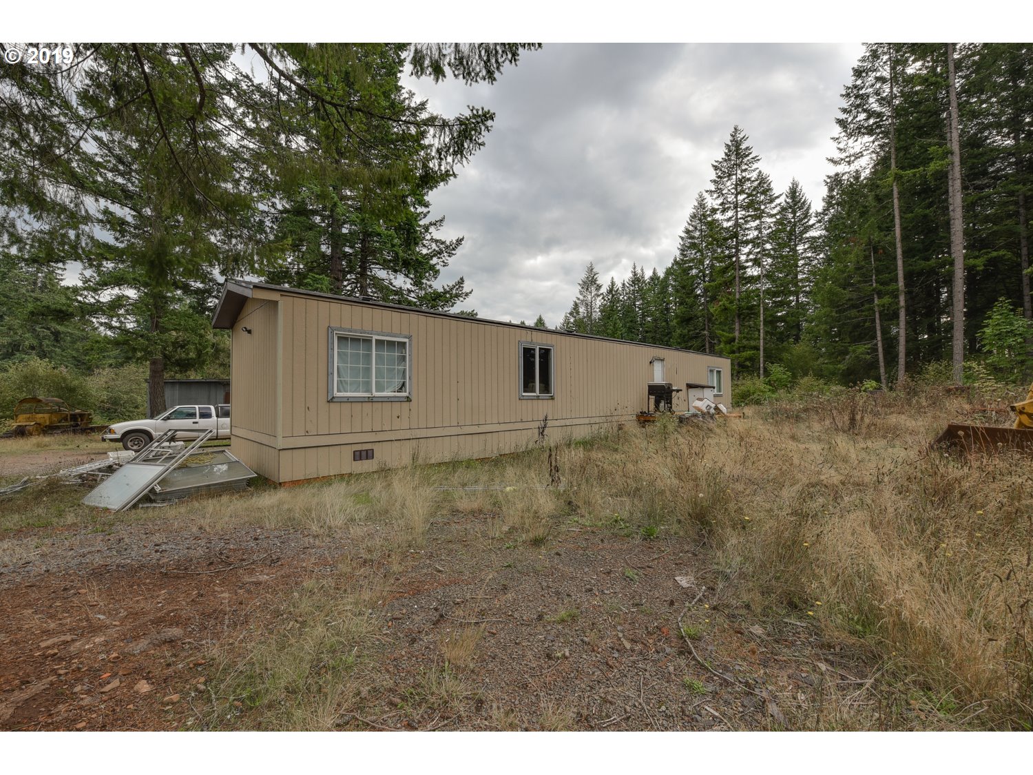 20188 South Redland Road Oregon City, OR 97045 - Photo 3 of 31 a view of a barn house in the middle of a field
