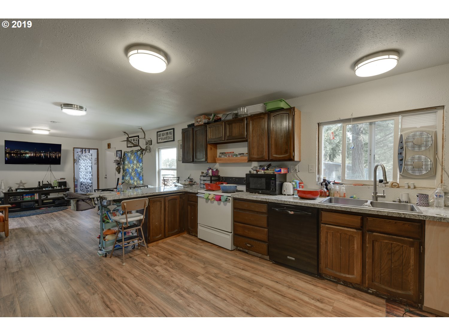 20188 South Redland Road Oregon City, OR 97045 - Photo 7 of 31 a kitchen with stainless steel appliances granite countertop a sink dishwasher stove and wooden cabinets