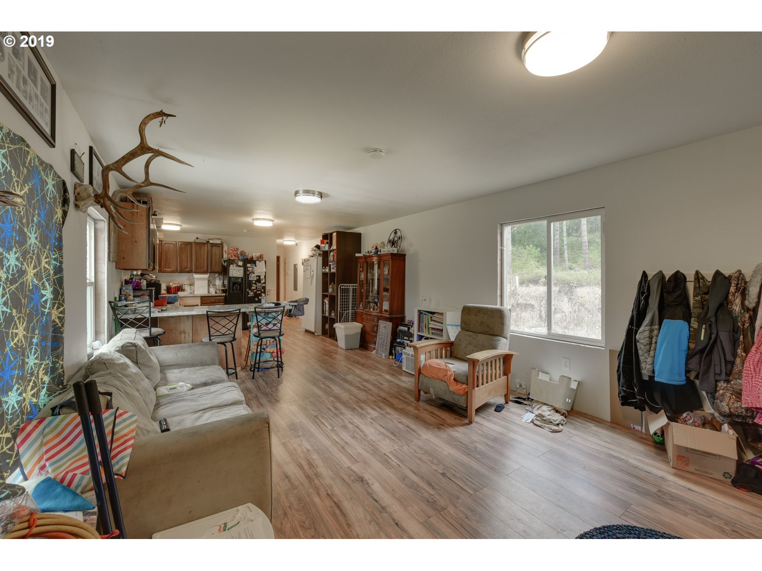 20188 South Redland Road Oregon City, OR 97045 - Photo 8 of 31 a living room with furniture and a flat screen tv