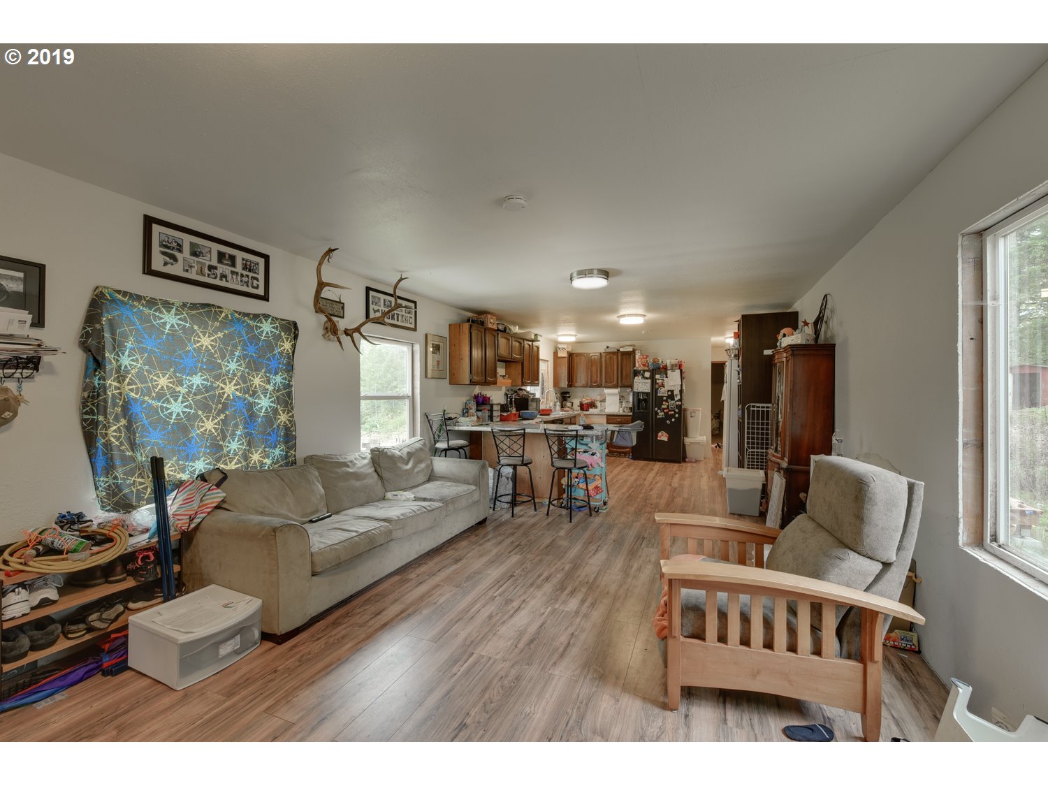 20188 South Redland Road Oregon City, OR 97045 - Photo 9 of 31 a living room with furniture and a flat screen tv