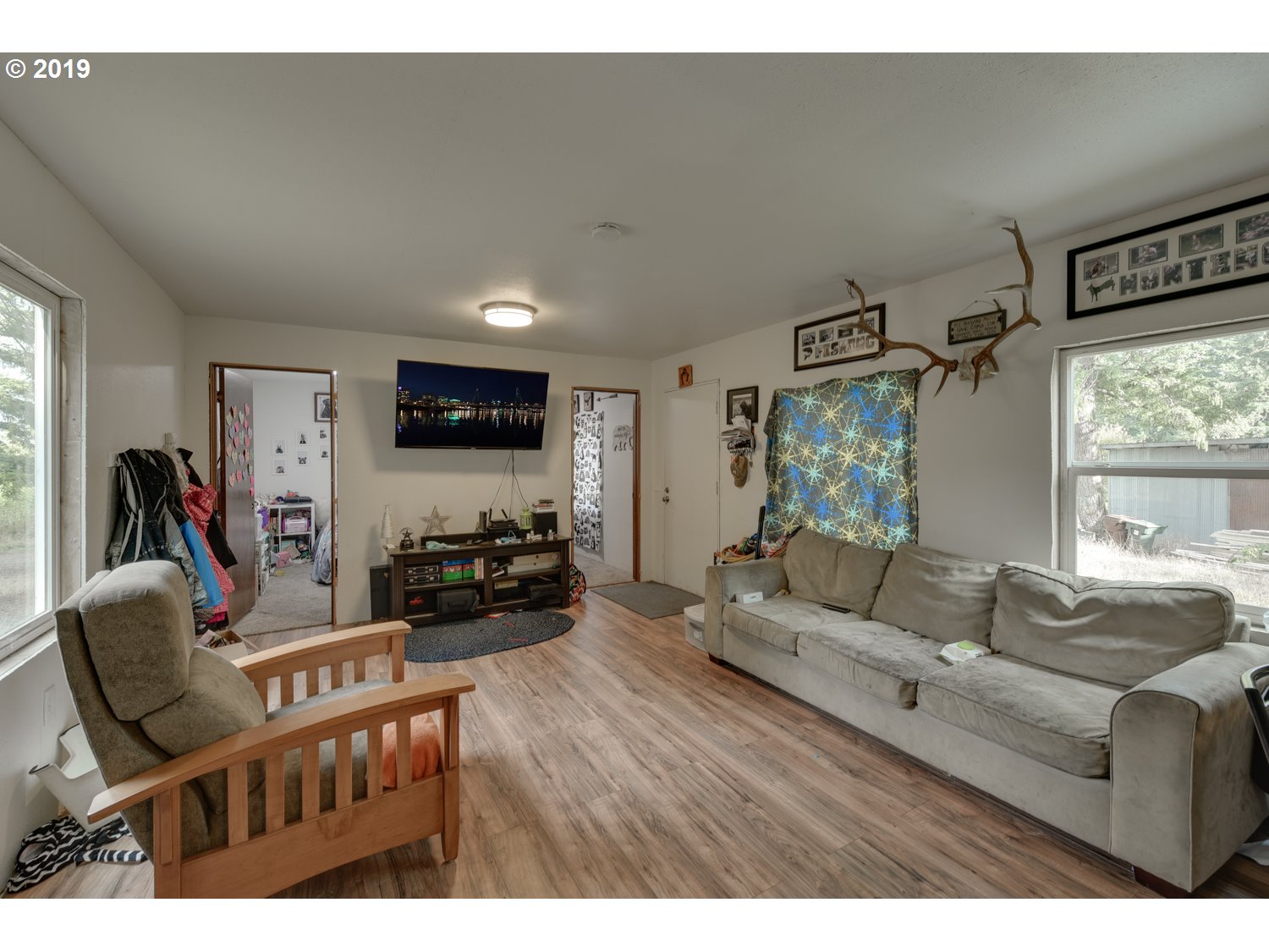 20188 South Redland Road Oregon City, OR 97045 - Photo 10 of 31 a living room with furniture and a flat screen tv