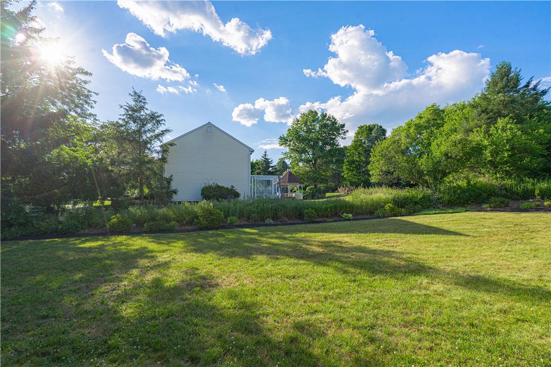 5425 Clauser Road Orefield, PA 18069 - Photo 10 of 18 A verdant backyard retreat offering ample space for outdoor leisure and entertaining.