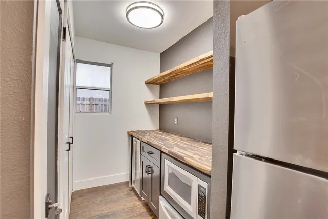 a kitchen with a stove and a refrigerator