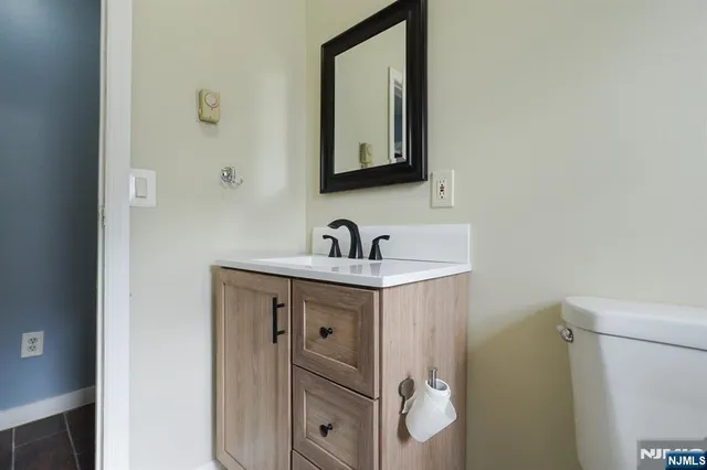a view of a room with wooden floor and window