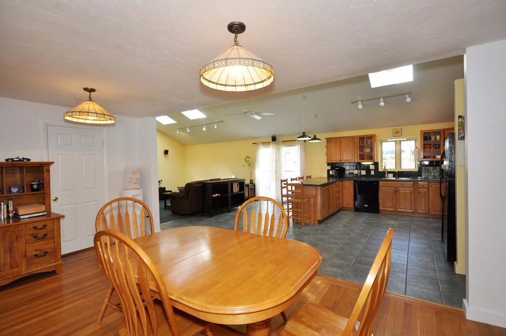 23 Wesson Road Ashland, MA 01721 - Photo 5 of 24 a view of a dining room with furniture and wooden floor