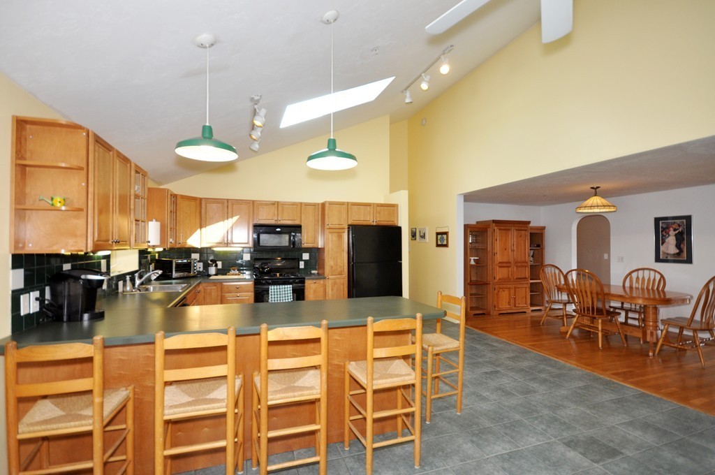 23 Wesson Road Ashland, MA 01721 - Photo 8 of 24 a large kitchen with a table and chairs