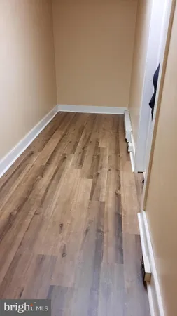 a view of wooden floor in an empty room
