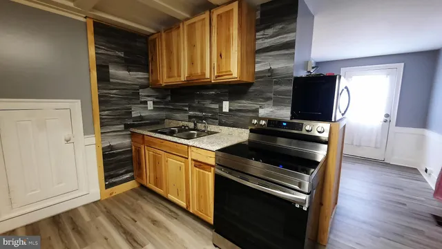 a kitchen with a stove and a microwave