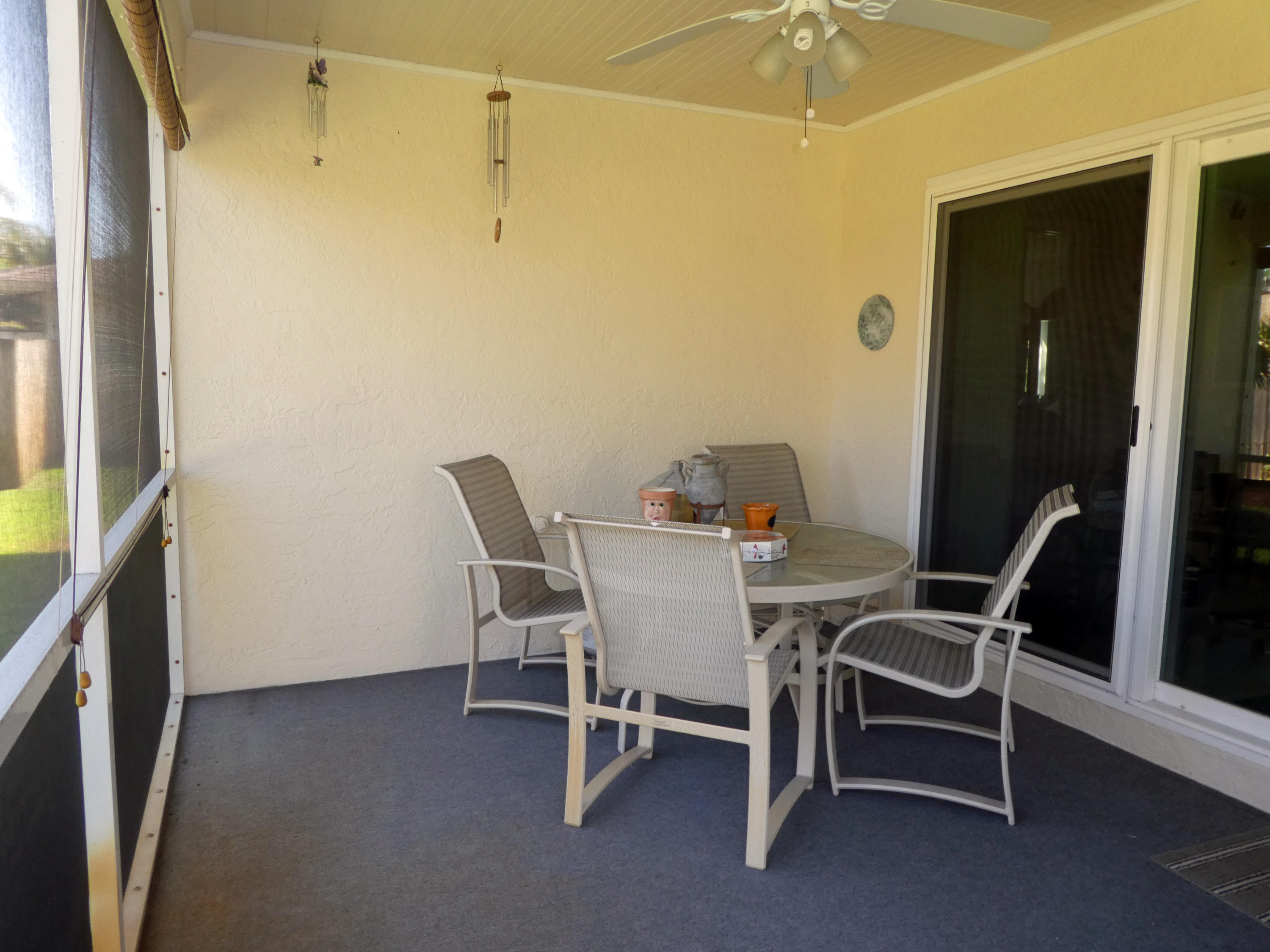 17670 Woodview Terrace Boca Raton, FL 33487 - Photo 15 of 24 a view of a dining room with furniture and a window