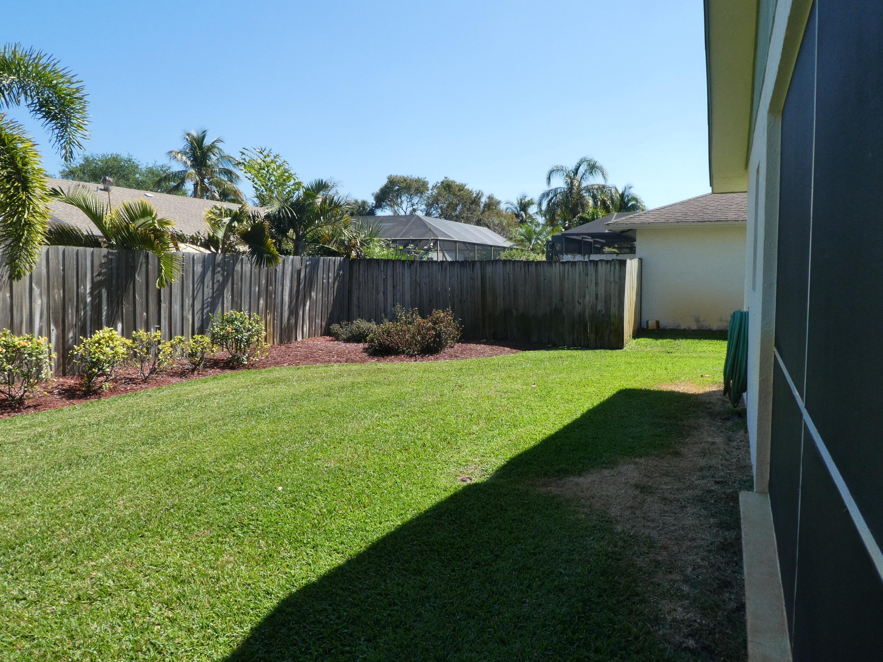 17670 Woodview Terrace Boca Raton, FL 33487 - Photo 17 of 24 a view of a back yard of the house