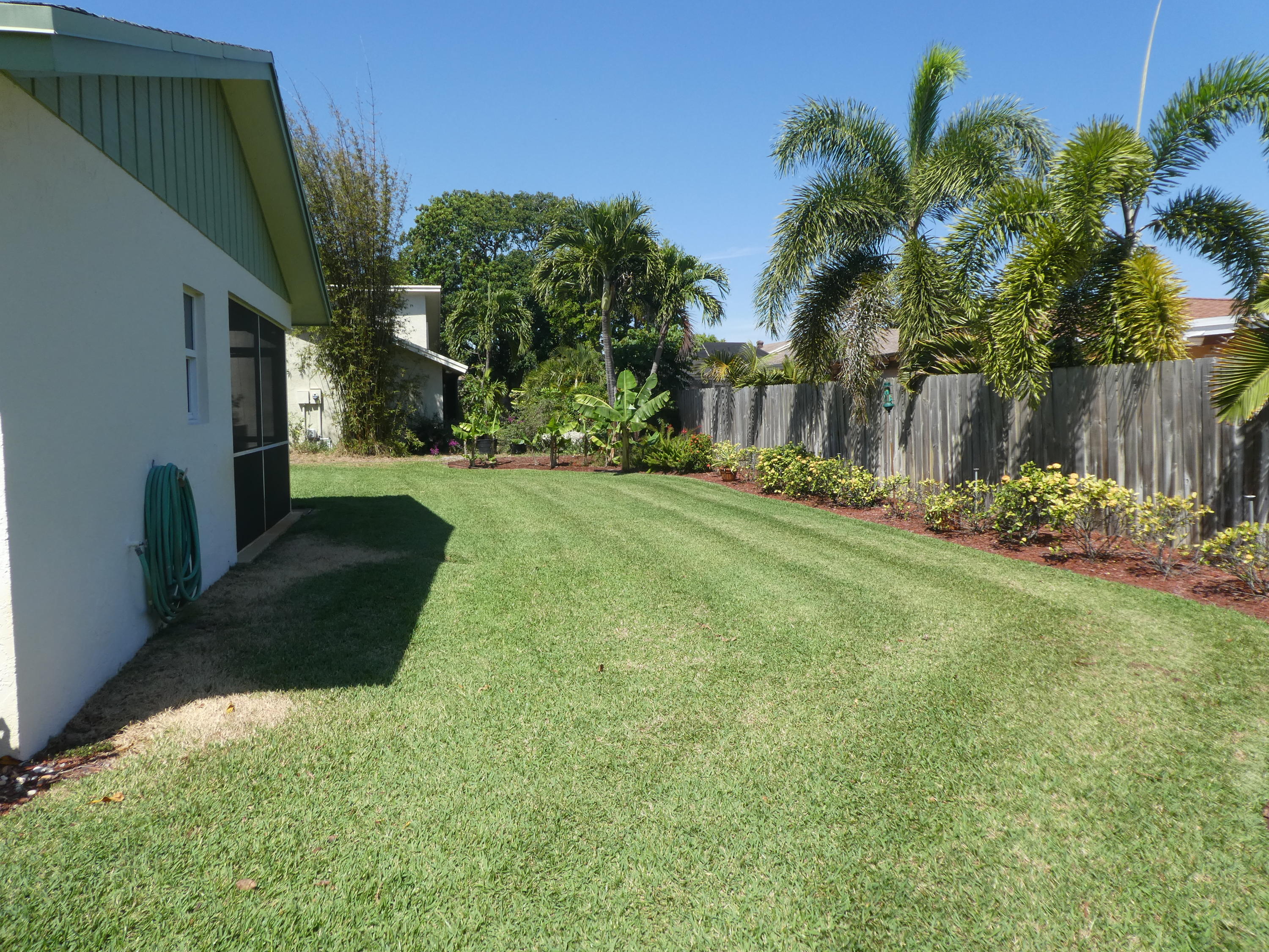 17670 Woodview Terrace Boca Raton, FL 33487 - Photo 20 of 24 a view of a backyard