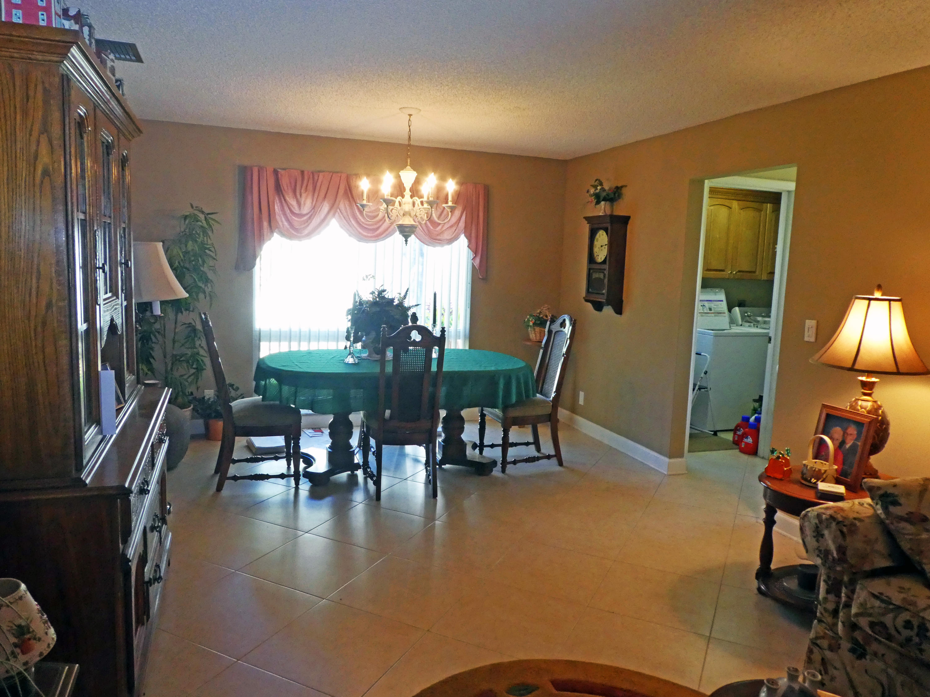 17670 Woodview Terrace Boca Raton, FL 33487 - Photo 4 of 24 a view of a dining room with furniture window and outside view