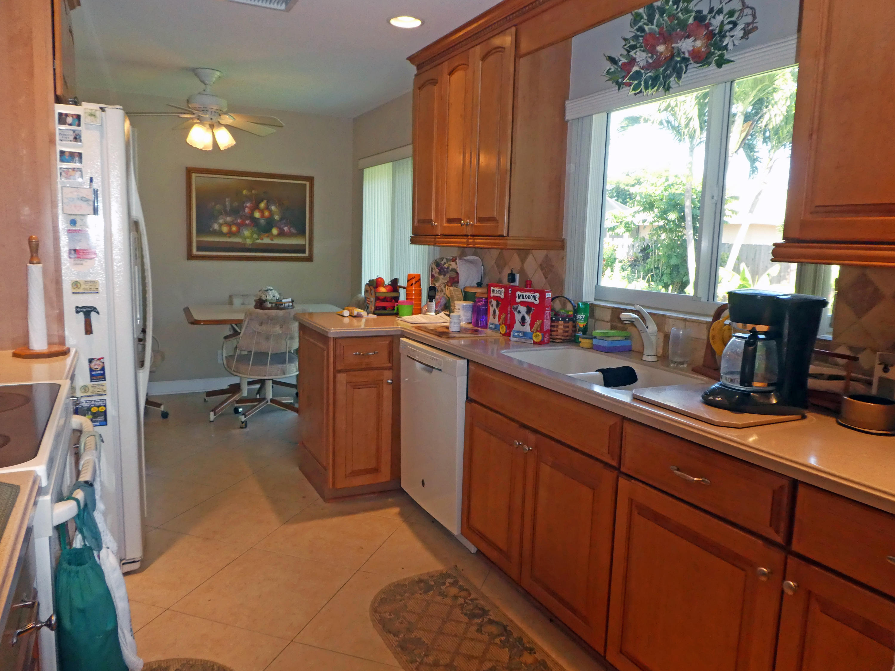 17670 Woodview Terrace Boca Raton, FL 33487 - Photo 5 of 24 a kitchen with a sink cabinets and window