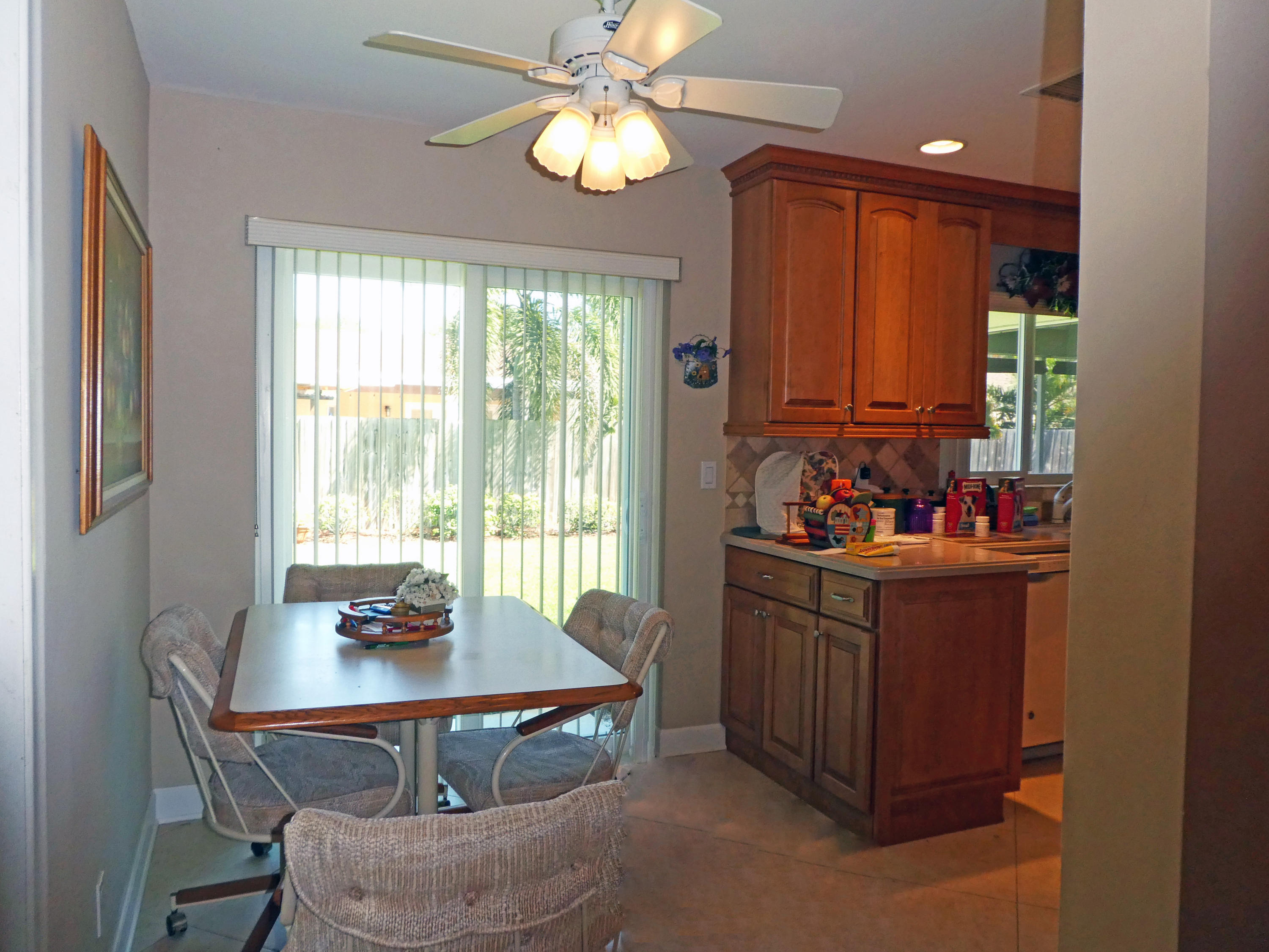 17670 Woodview Terrace Boca Raton, FL 33487 - Photo 7 of 24 a view of a dining room with furniture window and outside view