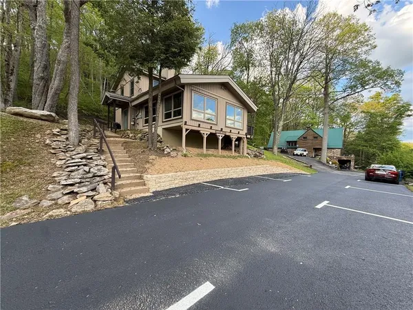 a house with trees in front of it