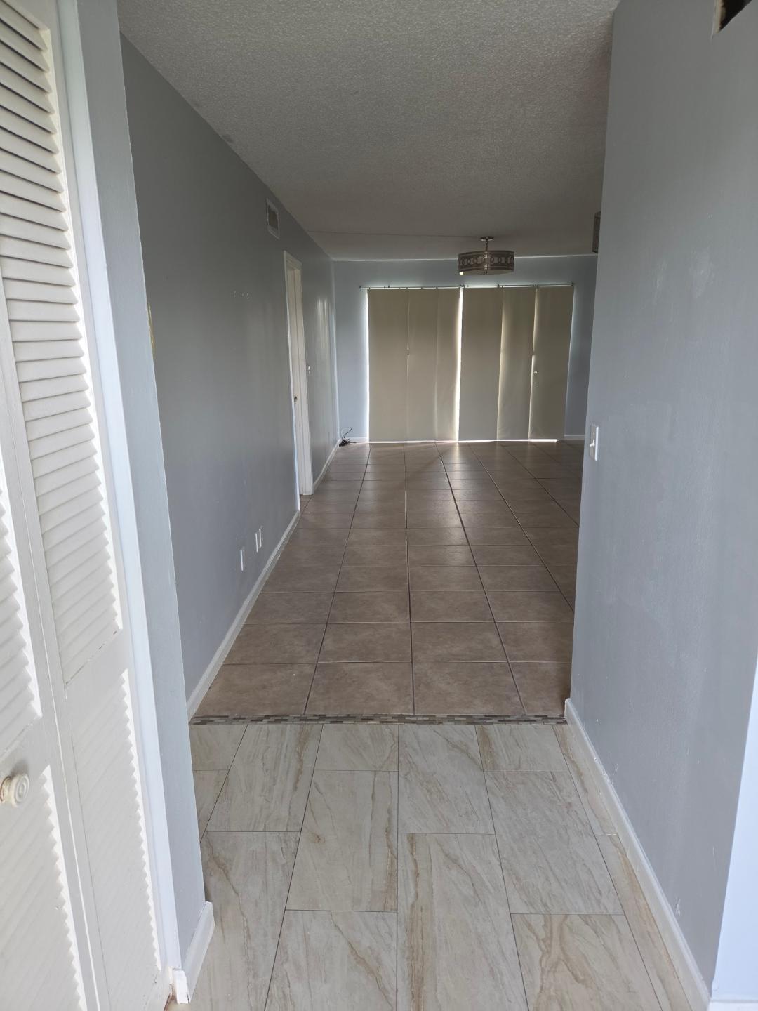 9949 Sandalfoot Boulevard, Unit 512 Boca Raton, FL 33428 - Photo 4 of 8 9949 SANDALFOOT APT 512 FRONT HALLWAY 1