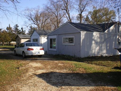 7369 Riverview Road Thomson, IL 61285 - Photo 1 of 6 a view of a house with a yard