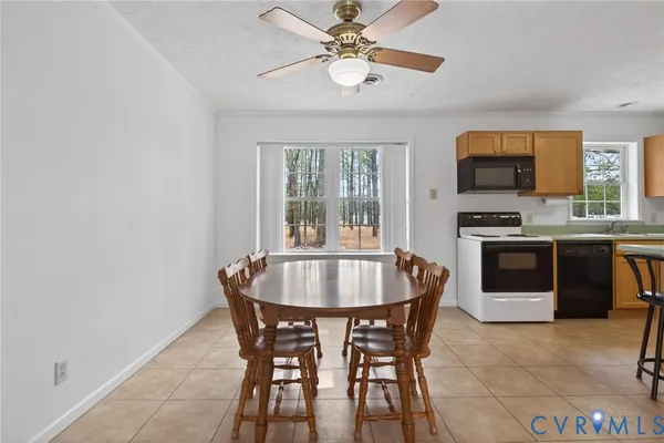 a dining room with furniture and window