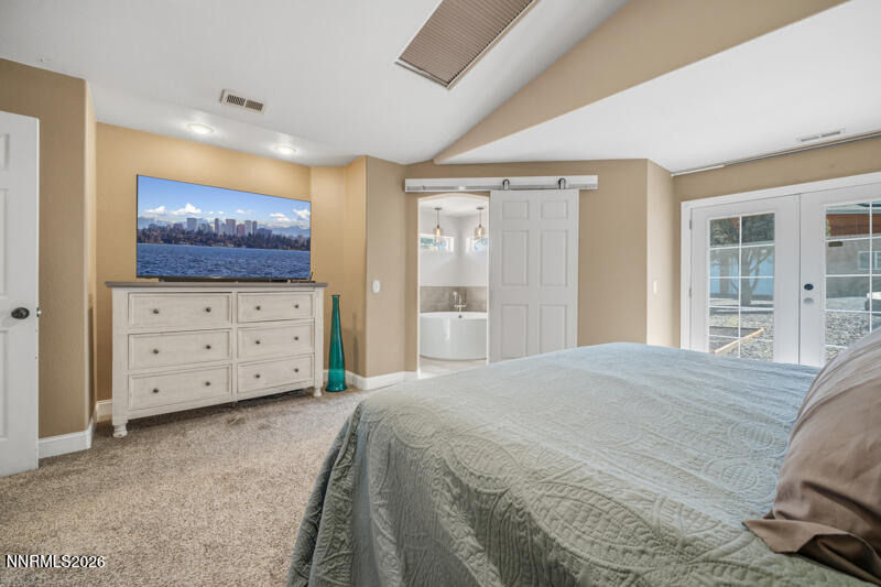 1931 Lousetown Road Reno, NV 89521 - Photo 14 of 51 a bedroom with a bed and a television