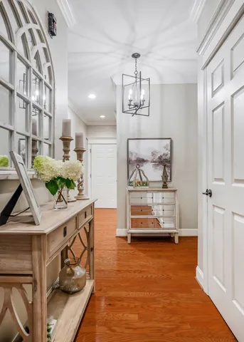 a view of a livingroom with furniture hardwood floor and a ceiling fan