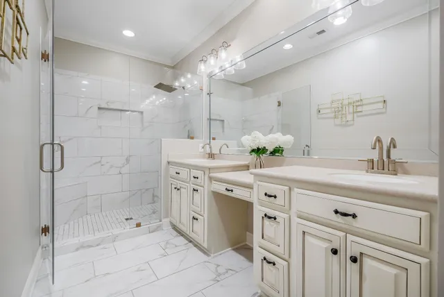 a spacious bathroom with a shower sink double and mirror