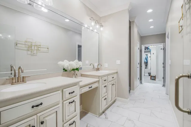 a spacious bathroom with a double vanity sink mirror and