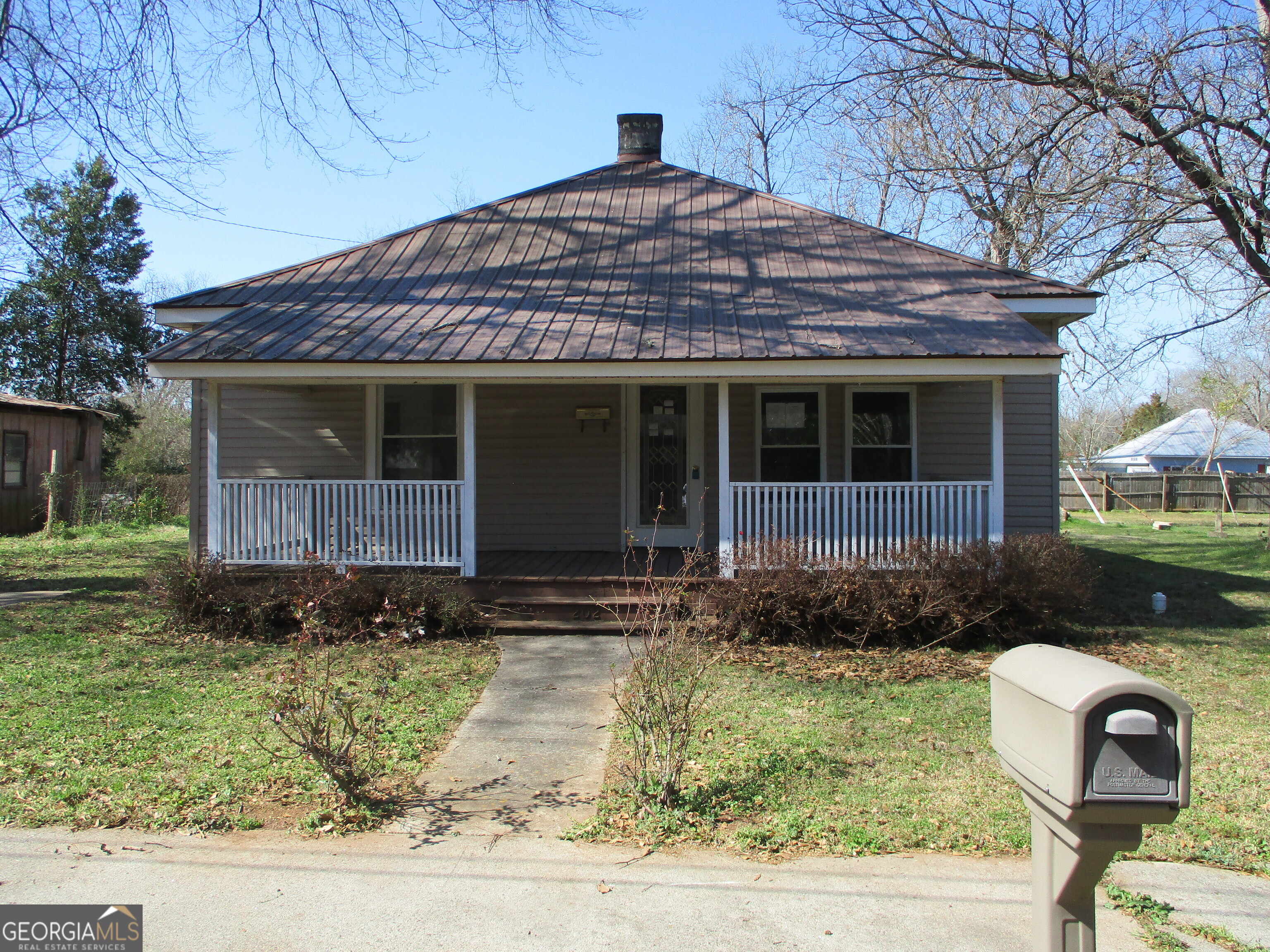 202 Ray Street Union Point, GA 30669 - Photo 1 of 1 a front view of a house with garden