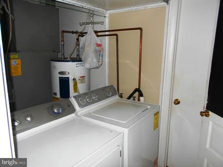 105 East Fourteenth Avenue Ranson, WV 25438 - Photo 12 of 17 a utility room with dryer and washer