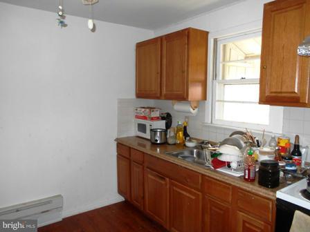 105 East Fourteenth Avenue Ranson, WV 25438 - Photo 4 of 17 a kitchen with sink cabinets and window