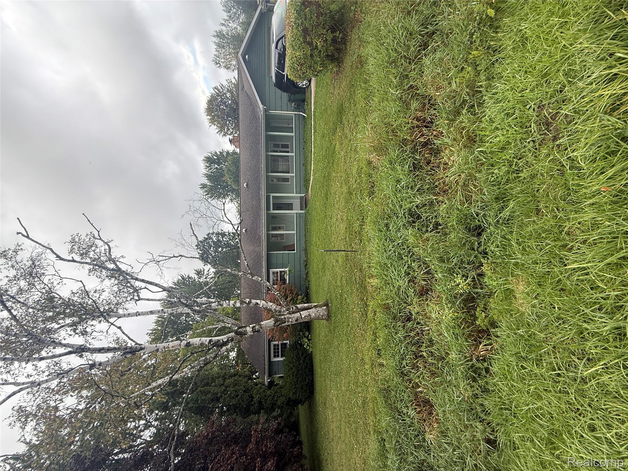 3176 East Fisher Road Bay City, MI 48706 - Photo 1 of 25 Ranch-style home with a front yard and a chimney