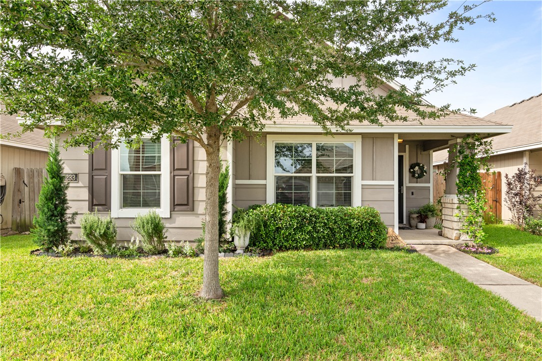 front view of a house with a yard
