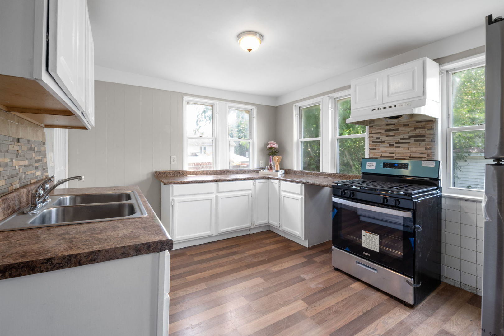 7518 South Rhodes Avenue Chicago, IL 60619 - Photo 3 of 12 a kitchen with a stove and a sink
