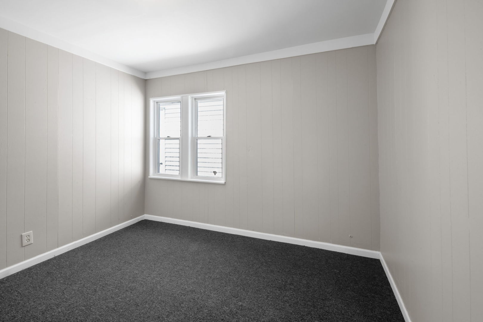7518 South Rhodes Avenue Chicago, IL 60619 - Photo 5 of 12 an empty room with a window