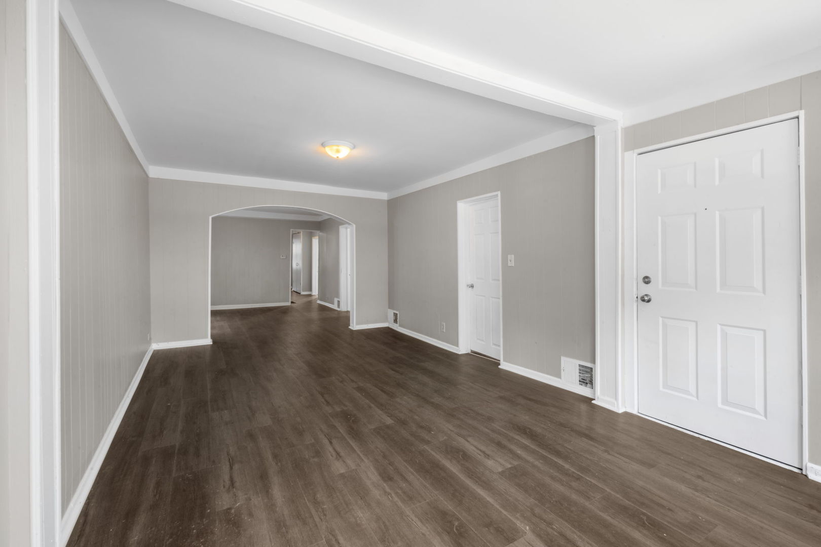 7518 South Rhodes Avenue Chicago, IL 60619 - Photo 6 of 12 wooden floor in an empty room with a window