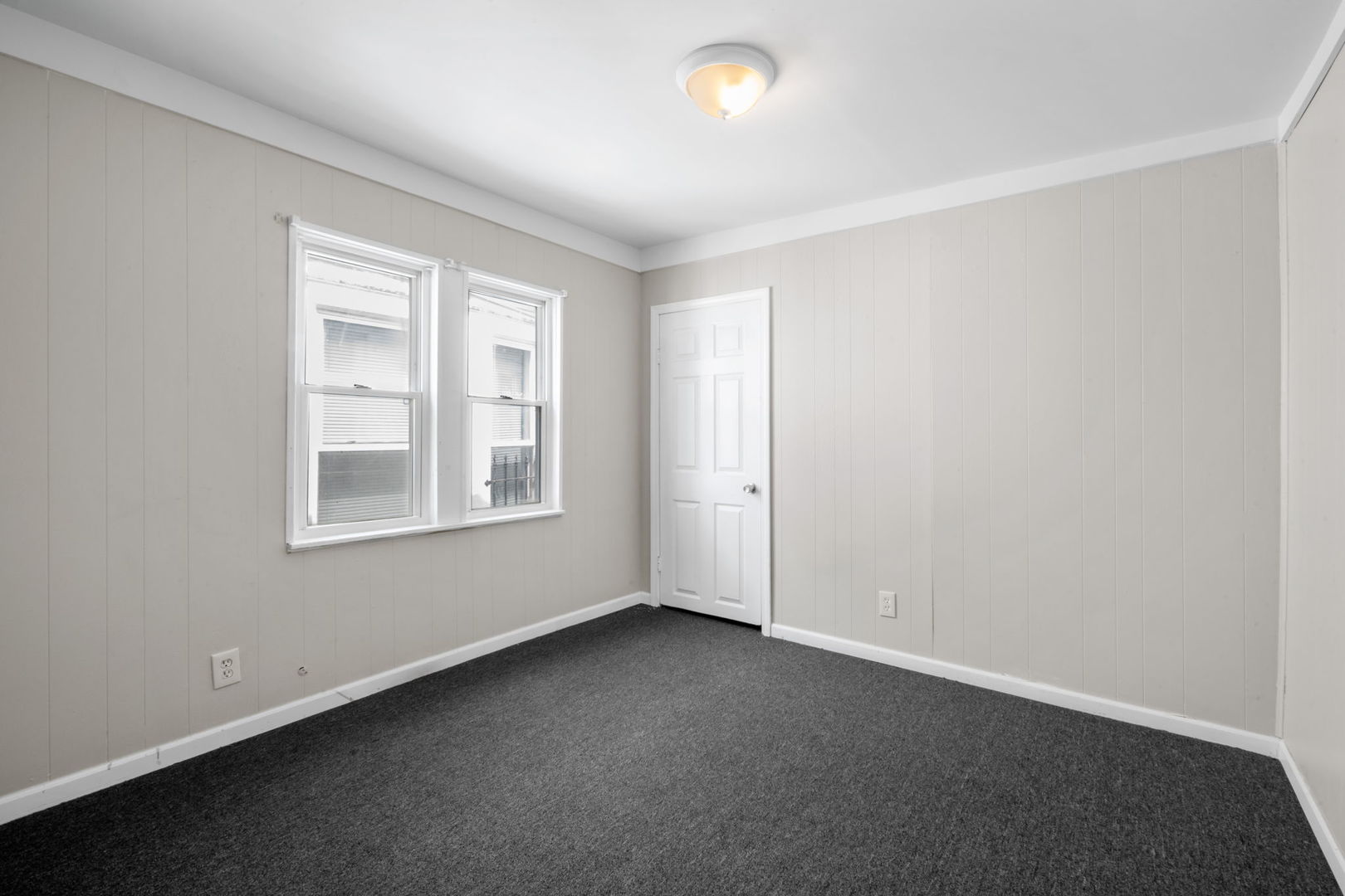 7518 South Rhodes Avenue Chicago, IL 60619 - Photo 7 of 12 an empty room with a window