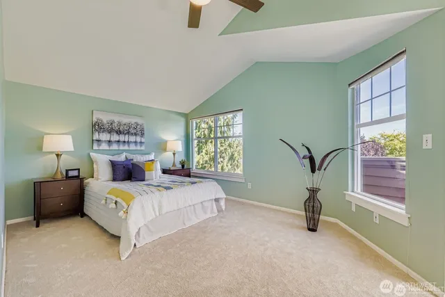 a bedroom with a bed and window