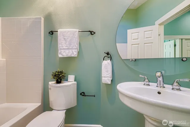 a bathroom with a sink toilet and a bathtub
