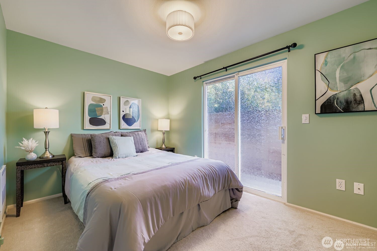 2622 East Madison Street Seattle, WA 98112 - Photo 24 of 38 a bedroom with a bed and a large window