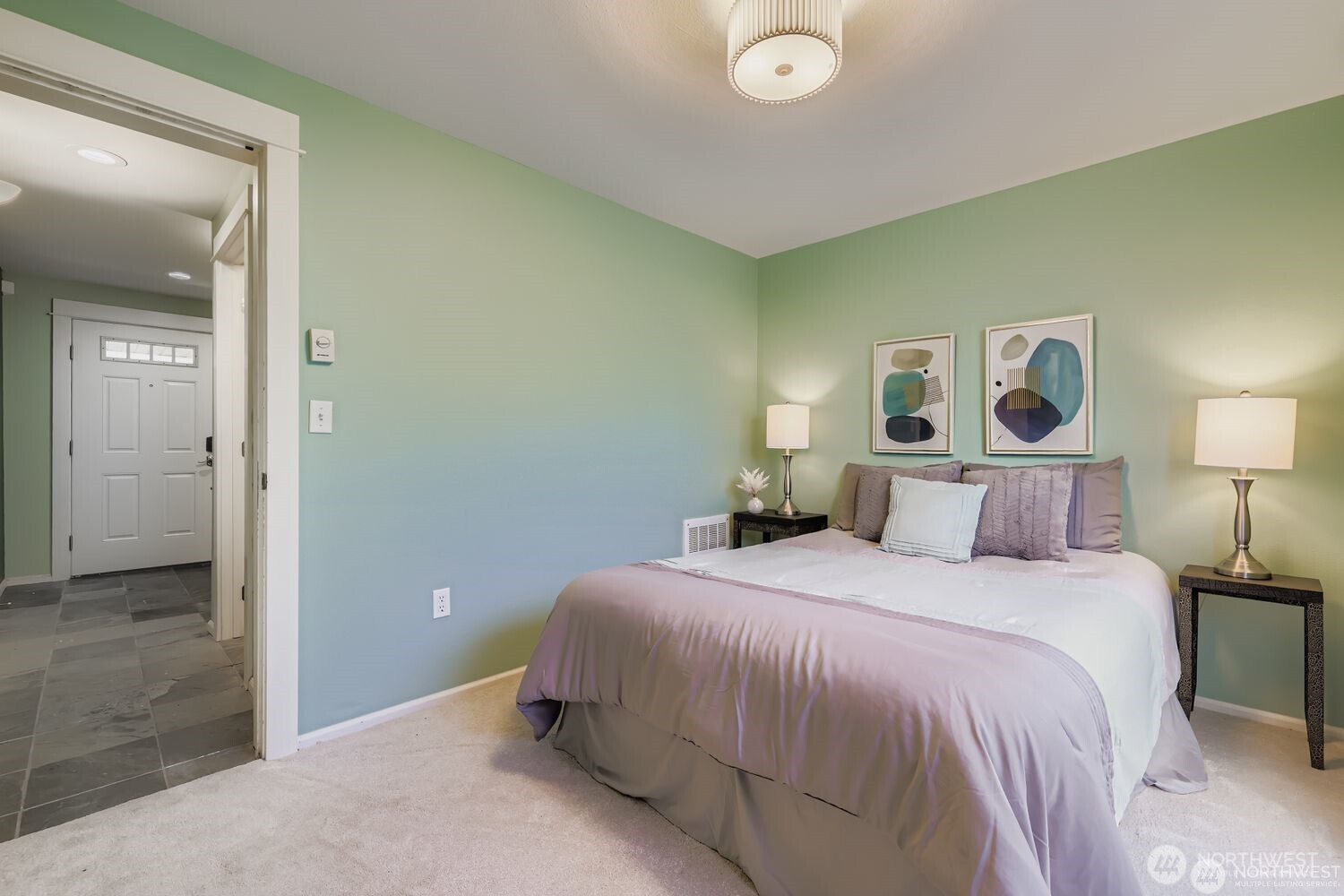 2622 East Madison Street Seattle, WA 98112 - Photo 25 of 38 a bedroom with a bed and a mirror