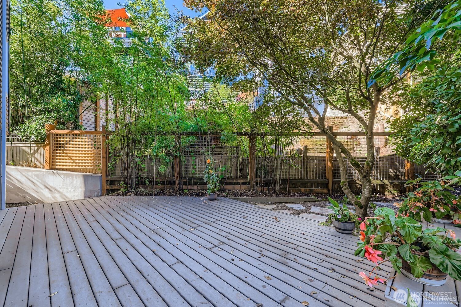 2622 East Madison Street Seattle, WA 98112 - Photo 28 of 38 a backyard of a house with lots of green space
