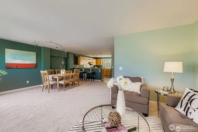 a living room with furniture and a lamp