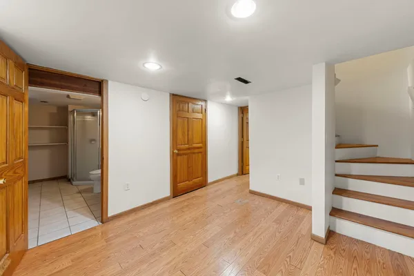 a view of entryway with wooden floor
