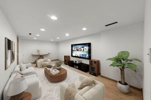 a living room with furniture flowerpot and a potted plant