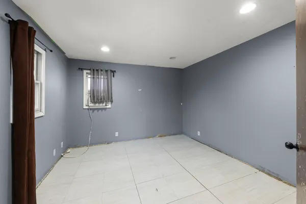 a view of an empty room with a window